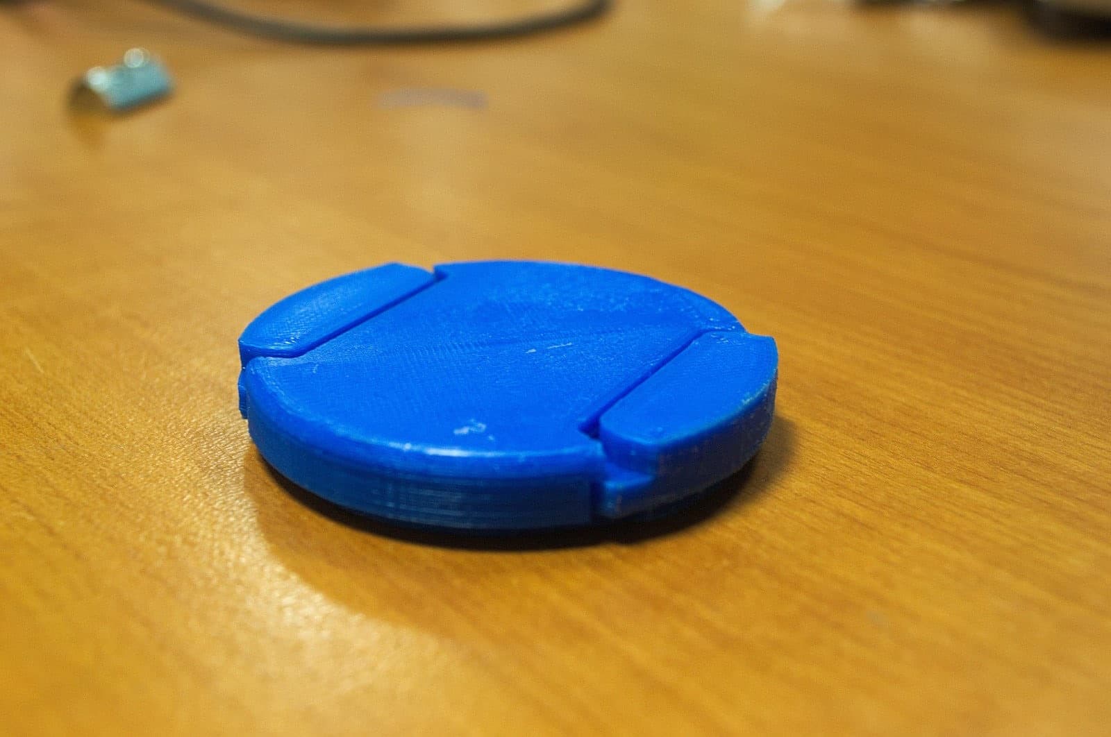 52mm lens cap on a table