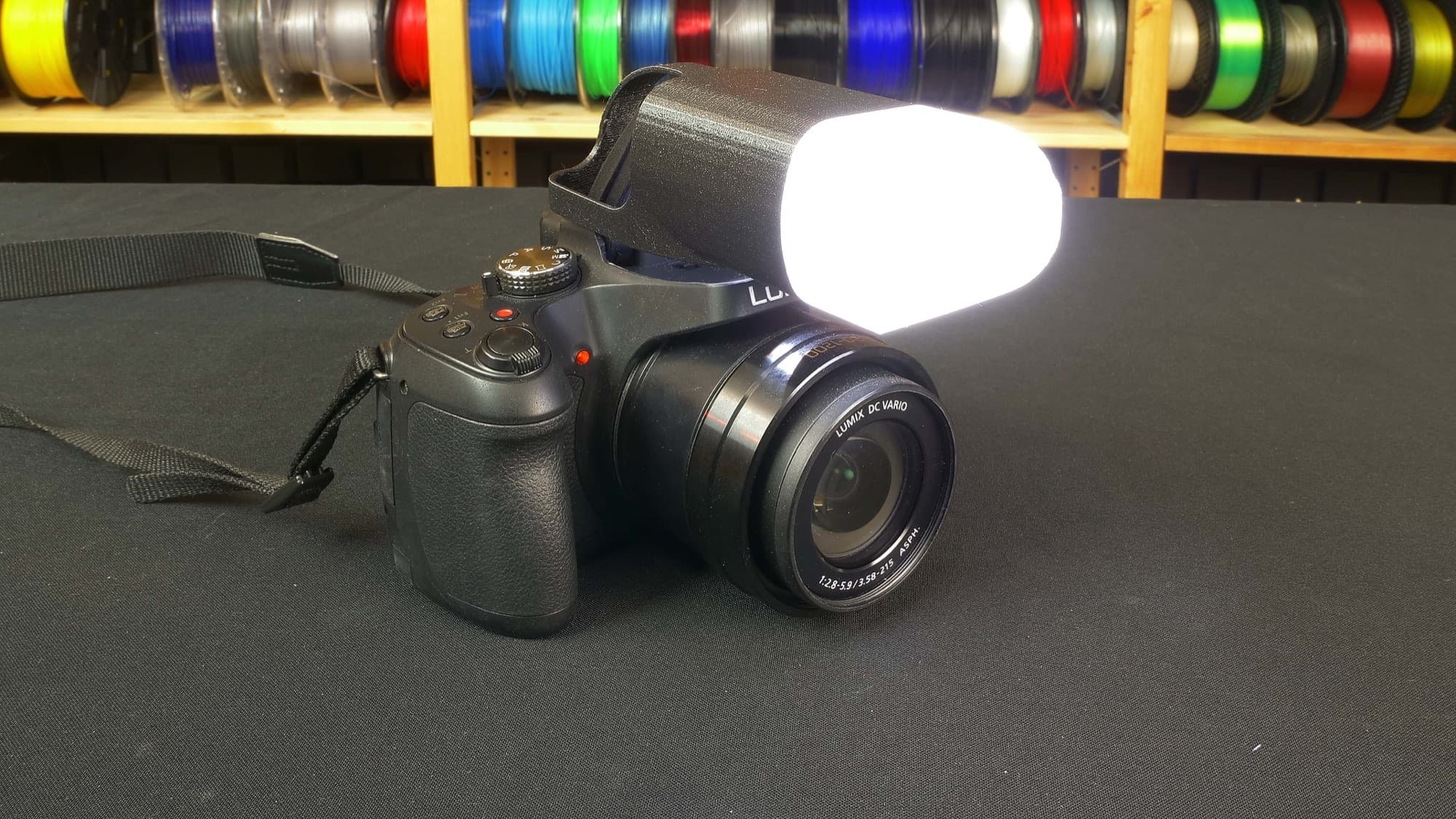 Camera flash diffuser mounted on a camera