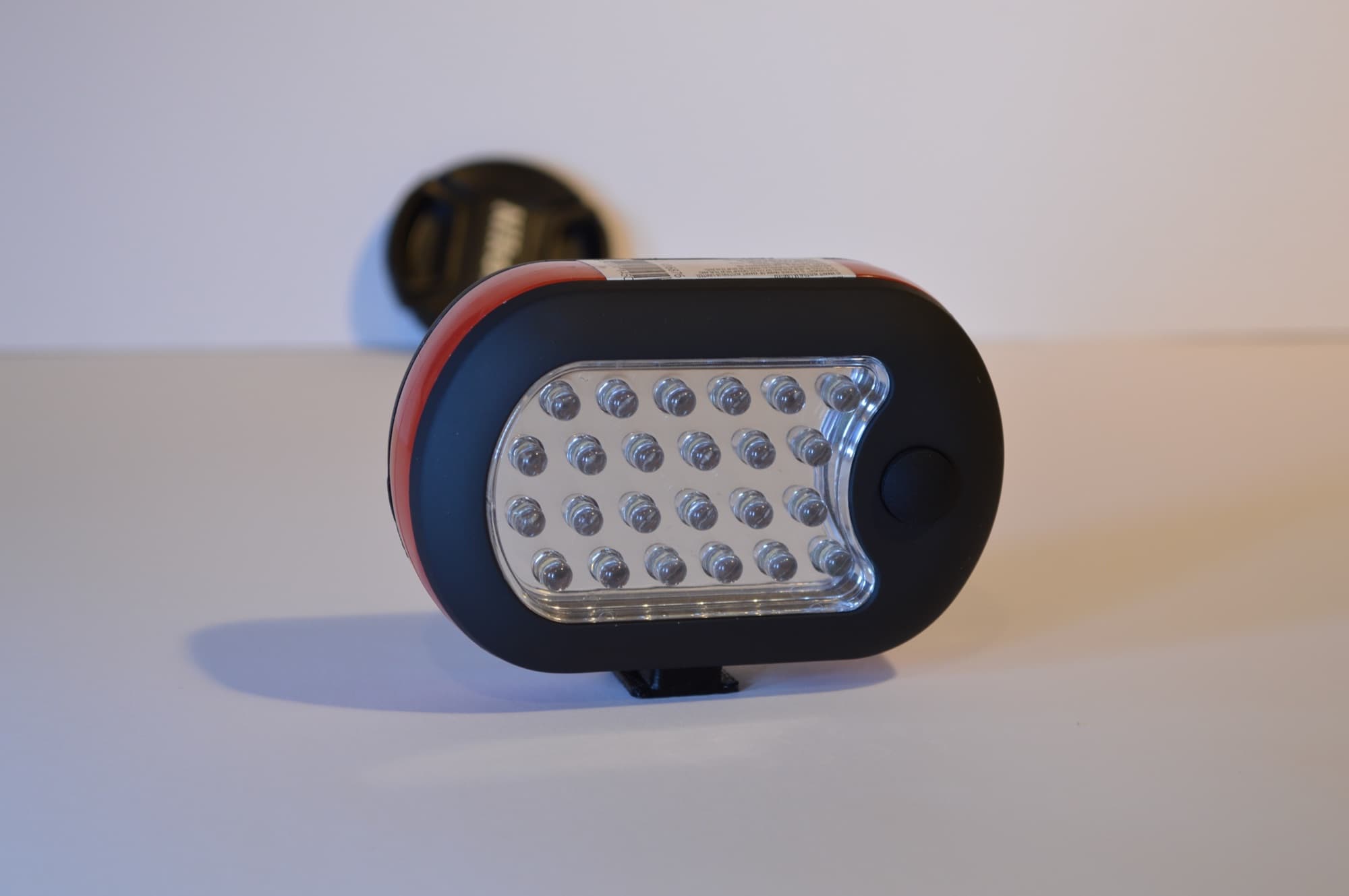 Cold shoe adapter with an LED light mounted on a camera