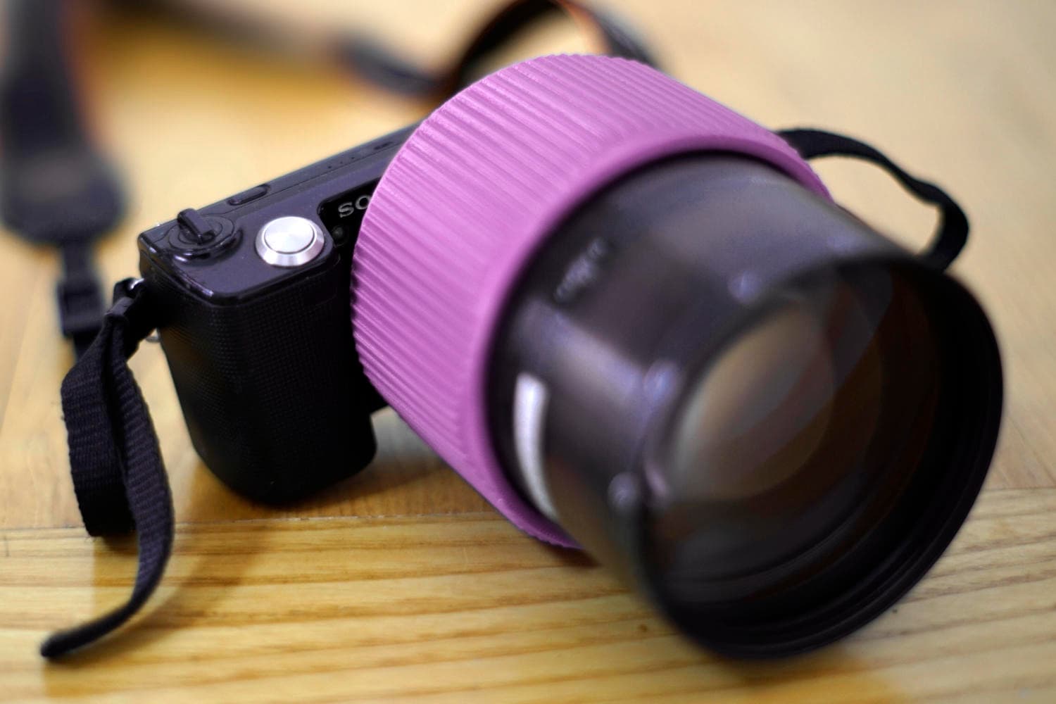 Focusing E-mount adapter mounted on a Sony camera