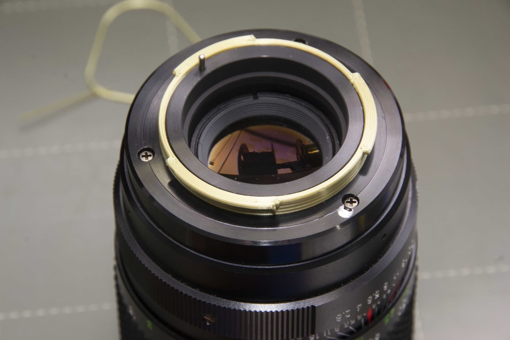 M42 to Nikon F-mount adapter mounted on a lens
