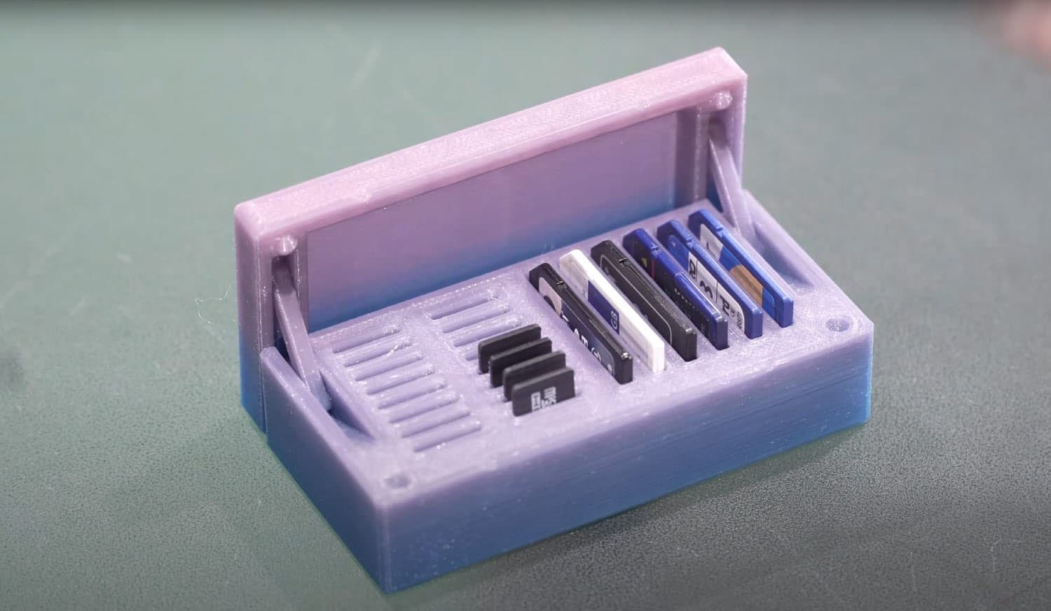 SD card holder box, printed, holding a mix of memory cards